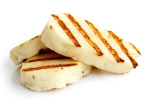 Three,Grilled,Slices,Of,Halloumi,Cheese,Isolated,On,White,In Χαλλούμι